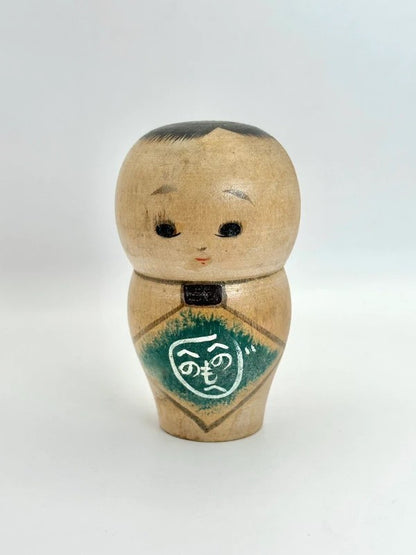 K10012 - Sosaku baby kokeshi doll