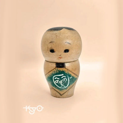 K10012 - Sosaku baby kokeshi doll