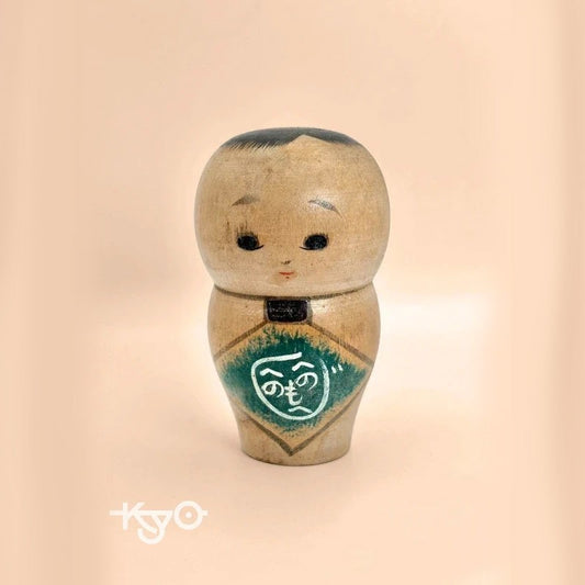 K10012 - Sosaku baby kokeshi doll