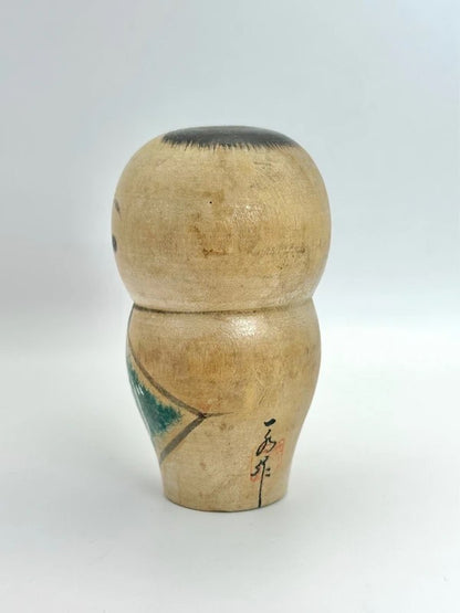 K10012 - Sosaku baby kokeshi doll